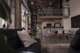 dark, masculine, open-concept loft-style home